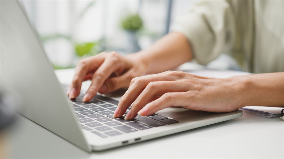 Person using a laptop at a desk